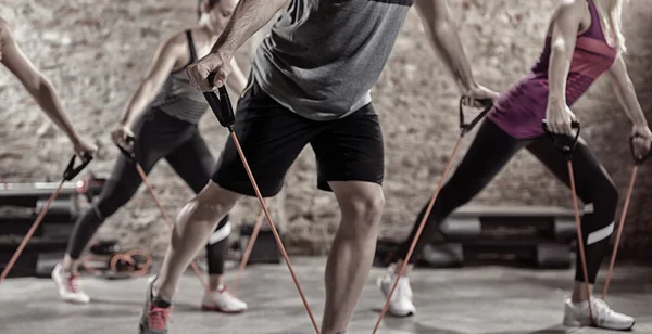 Exercising with stretching band — Stock Photo, Image