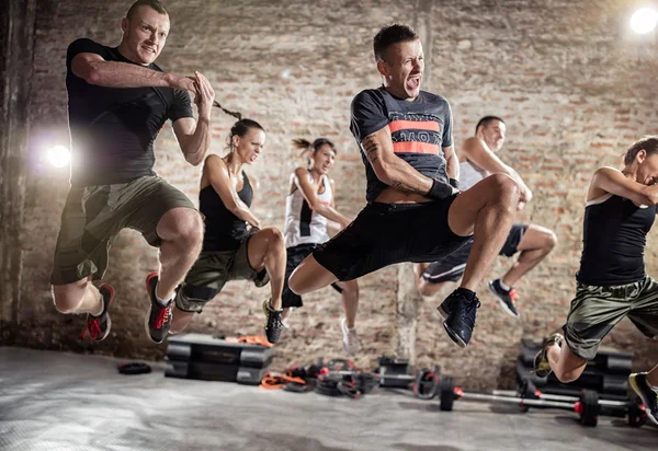 Group of people practicing cardio fitness exercise — Stock Photo, Image