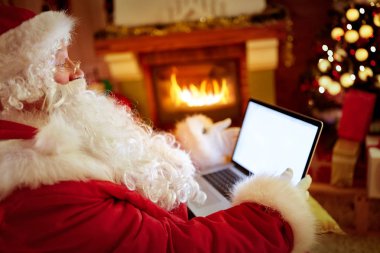 Noel Baba dizüstü kullanarak