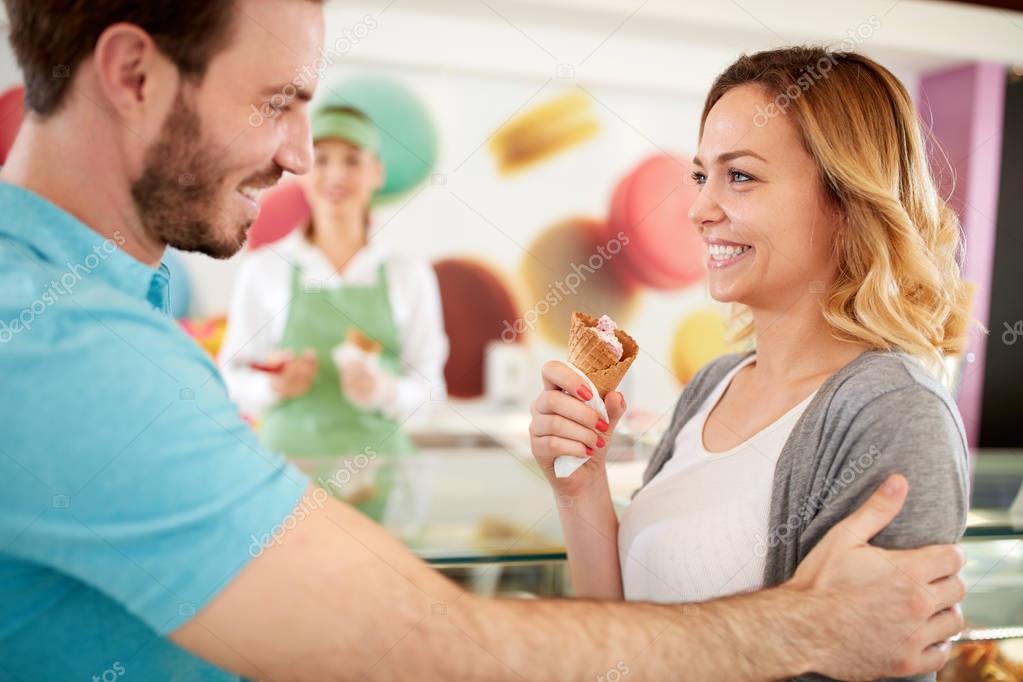 Happy woman enjoy in ice cream in confectionery   