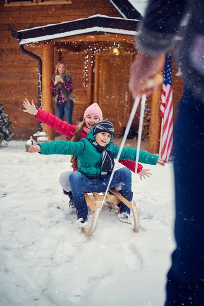 Winter fun - children sledding — Stock Photo, Image