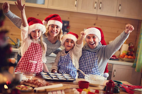 Happy family baking cookies on xmas — Stock Photo, Image