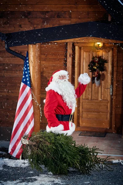 Santa Claus with Christmas tree -Christmas, holidays and people — Stock Photo, Image