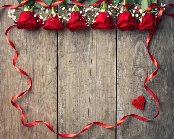 Red roses with ribbon frame — Stock Photo, Image