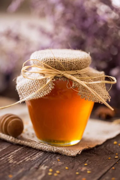 Naturhonig. Honig im Glas Hintergrund — Stockfoto