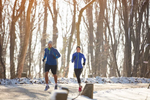 Two person jogging in nature