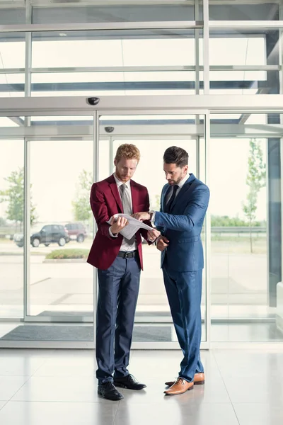 Partners studying papers — Stock Photo, Image