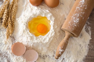 Basic ingredients for baking - eggs, dough, flour and rolling-pitch clipart