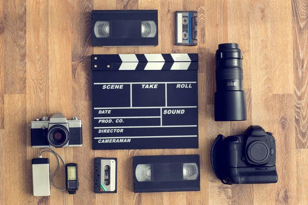 Old retro and modern equipment on wooden board — Stock Photo, Image