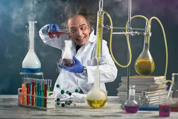 Crazy chemist doing experiment — Stock Photo, Image