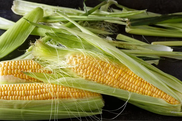 Fresh corn on black background — Stock Photo, Image
