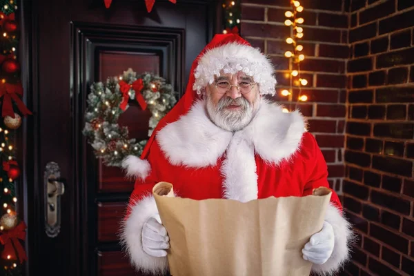 Santa Claus reading list of children wishes for Christmas gifts