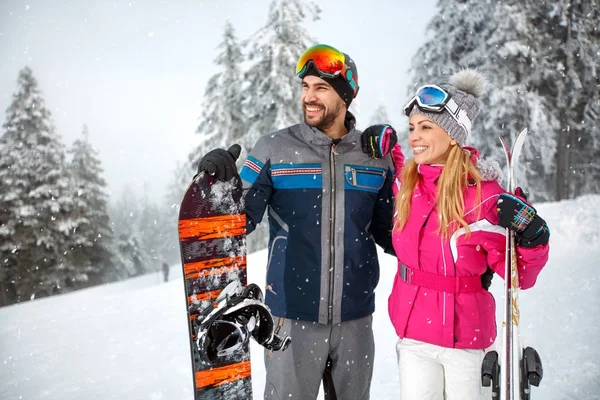 Male and female on skiing for winter holiday — Stock Photo, Image