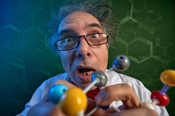 Funny scientist with model molecules