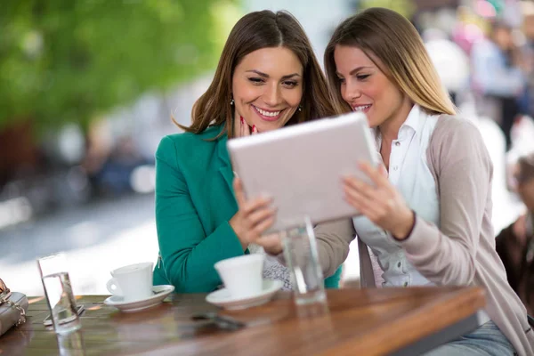 Young Girls Sitting Cafe Reading Gossip Message Digital Tablet — Stock Photo, Image