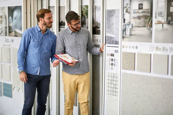 Man with salesman in store for the house — Stock Photo, Image