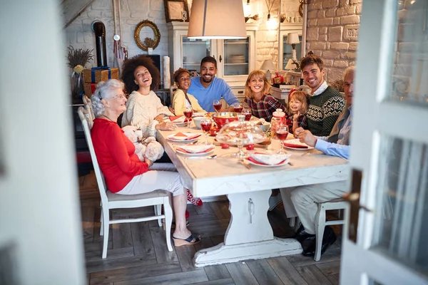 Group of happy people gathered during Christmas time — Stock Photo, Image