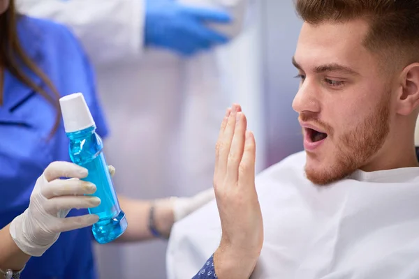 Dental patient trying breath freshener — Stock Photo, Image