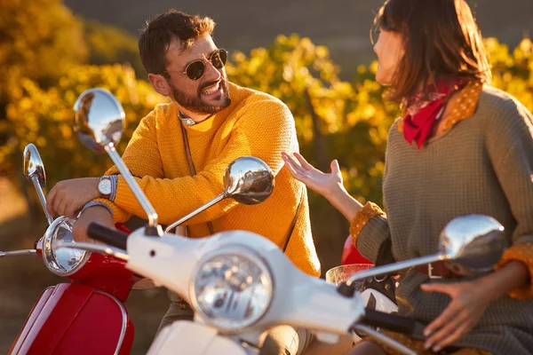 Cheerful man and girl  riding a scooter and having fun. — Stock Photo, Image