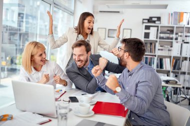 colleagues celebrate success.business people completed  meeting