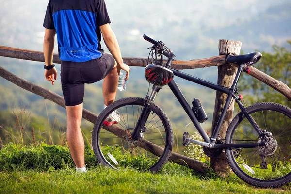 Biker on break enjoy in nature .Spring, nature ,sport concept