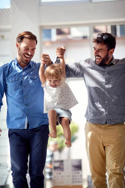 Parents having fun with child at shopping — ストック写真