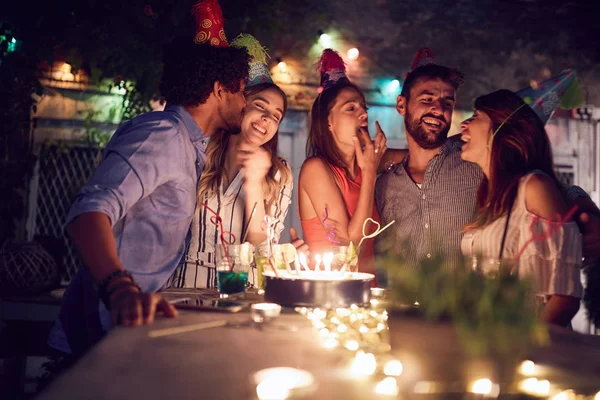 Group of young friends celebrating a  birthday in the club with — Stock Photo, Image