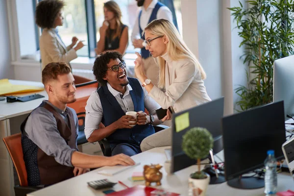 Colleagues laughing at work in modern office. casual modern busi — Stock Photo, Image