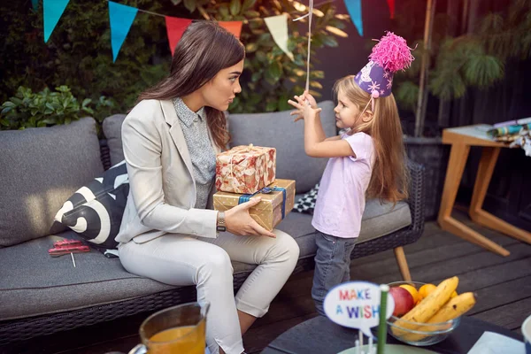 Young Female Brunette Holding Birthday Present Talking Sweet Little Girl — Stock Photo, Image