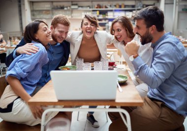 group of young adults hugged having a video call at lunchtime in restaurant. fun, technology, online, internet, friends, business partners, colleagues clipart