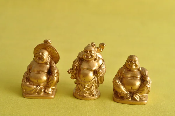 Figurines of a laughing and cheerful golden Buddhas — Stock Photo, Image