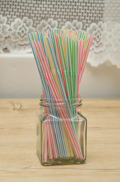 Drinking straws in a bottle — Stock Photo, Image
