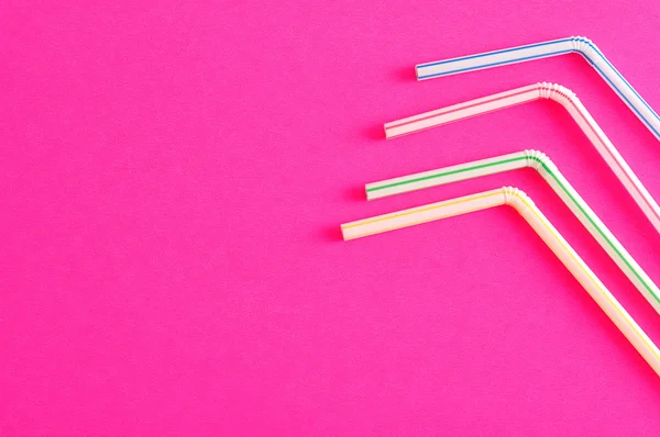 Bended drinking straws on a pink background — Stock Photo, Image