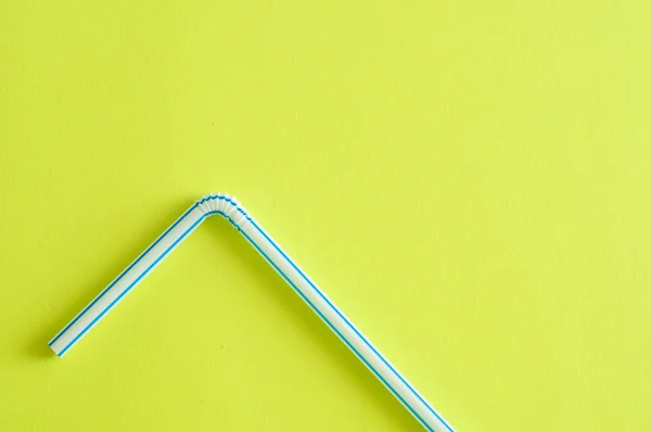 A drinking straw on a yellow background — Stock Photo, Image