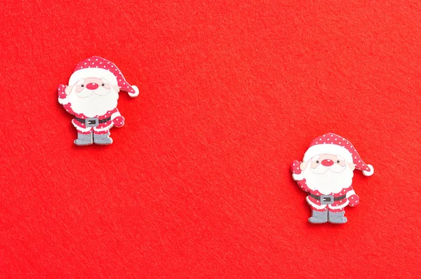 Santa's isolated on a red background — Stock Photo, Image