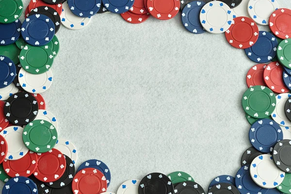 Poker chips forming a border with a white background — Stock Photo, Image