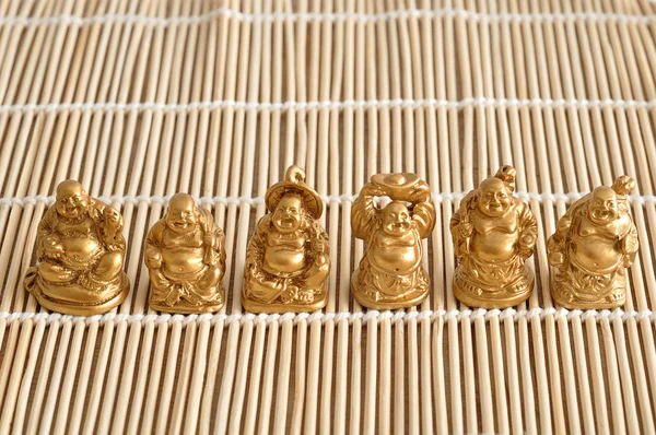 Figurines of laughing and cheerful golden Buddhas — Stock Photo, Image