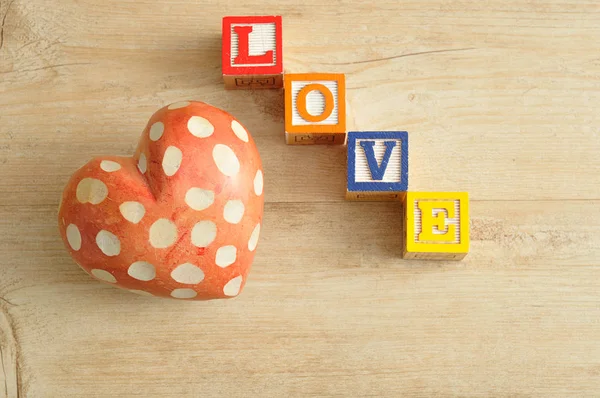 Valentine\'s Day. Love spelled with colorful alphabet blocks