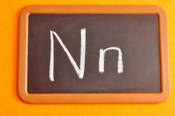 A black board with the alphabet letter N — Stock Photo, Image