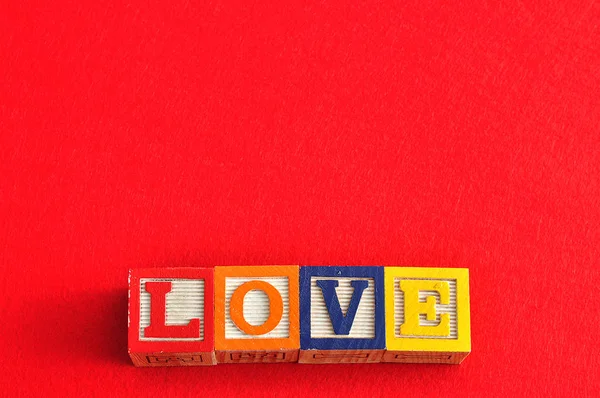 Valentine 's Day. Love Spelled with colorful alphabet blocks — стоковое фото