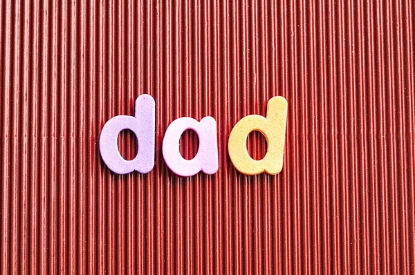 The word dad on a brown background — Stock Photo, Image