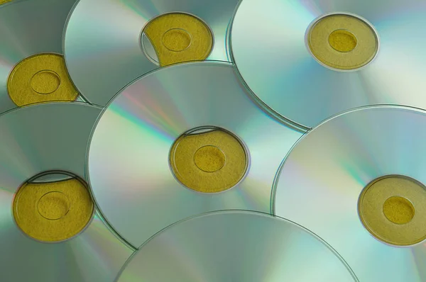 Een full frame van cd's met een gele achtergrond — Stockfoto