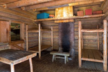 Fort Clatsop Log Cabin living quarters with bunk beds table and chair in Lewis and Clark Historical National State Park clipart