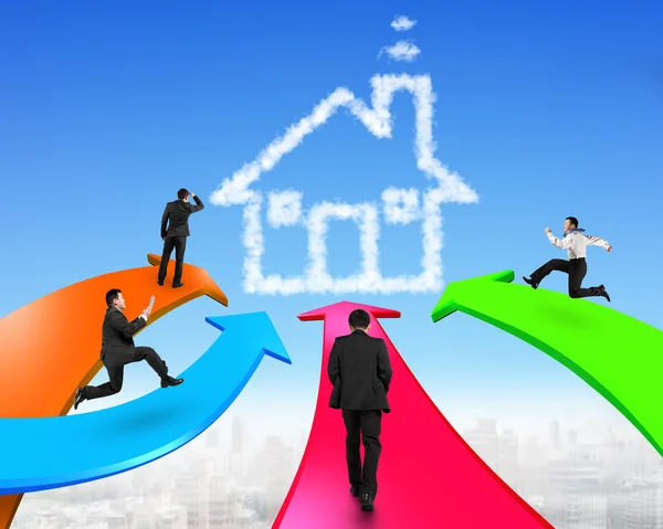 Men on four color arrows go toward house shape cloud — Stock Photo, Image