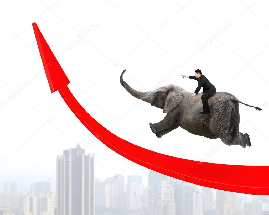 Businessman riding elephant on red arrow up trend line