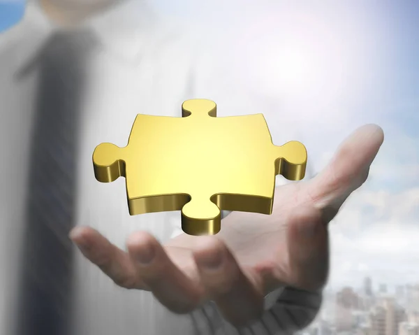 Man hand showing golden puzzle piece — Stock Photo, Image