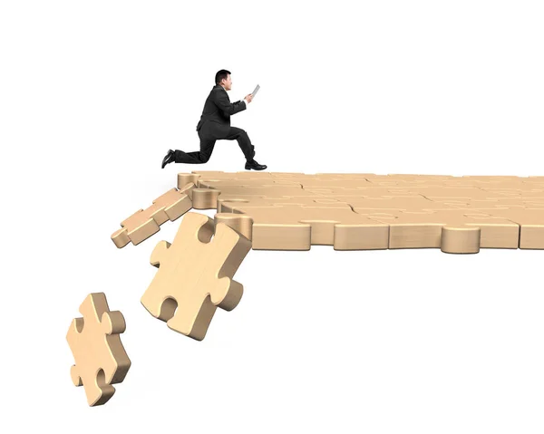 Man using tablet running on breaking puzzle path — Stock Photo, Image