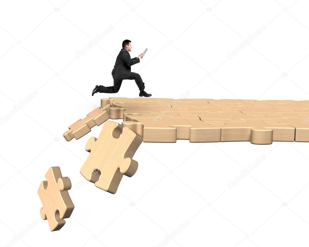 Man using tablet running on breaking puzzle path