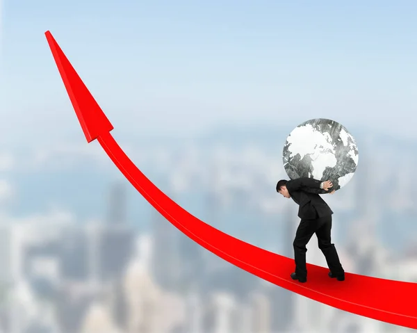 Man carrying globe upward on red trend line — Stock Photo, Image