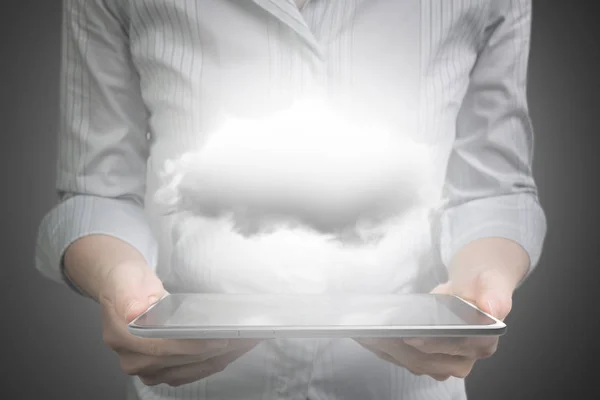 Hands holding smart tablet with white cloud — Stock Photo, Image